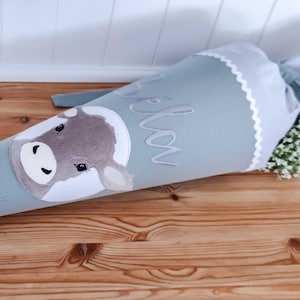 Sac d'école sac à sucre « Kuh Bela » avec nom en tissu pour la scolarisation