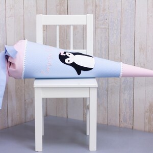 Cartable bio sac à sucre « Pingouin » bleu clair rose