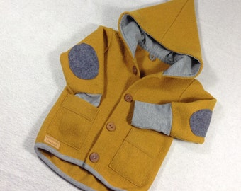 Walk jacket in mustard yellow with pockets/elbow patches, wooden buttons, pointed hood, young girls