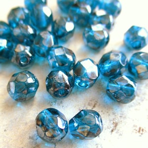 25 Böhmische Glasschliffperlen Capri Blue transparent gelüstert 6 mm original czech beads Glasperlen rund facettiert Perlenschmuck