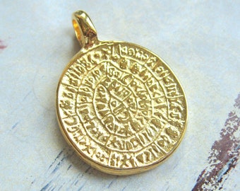 Metal pendant disc 34 x 25 mm gold-plated Phaistos discs coin pendant Mykonos Beads patinated charm jewelry Ethno Boho Festival