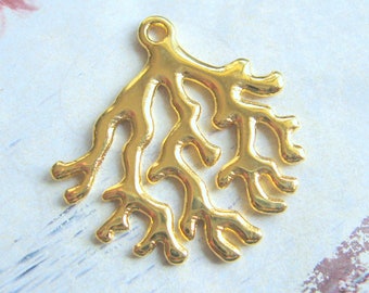 May include: Gold-toned metal charm shaped like a coral branch. The charm has a loop at the top for attaching to jewelry or other crafts.