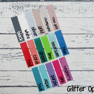 May include: A selection of glitter colour options presented on rectangular labels. Colours include black, white, red, coral, green, lime, aqua, purple, pink, raspberry, and others. The text "Glitter Options" is written in cursive at the bottom.