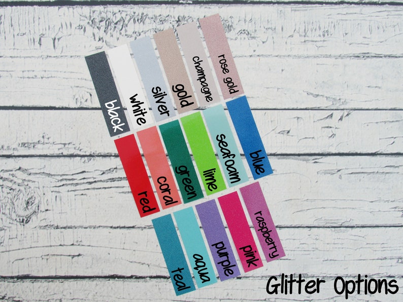 May include: A selection of glitter colour options presented on rectangular labels. Colours include black, white, red, coral, green, lime, aqua, purple, pink, raspberry, and others. The text "Glitter Options" is written in cursive at the bottom.