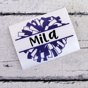 May include: White vinyl decal with a purple cheerleading pom-pom and the name "Mila" written across the center.