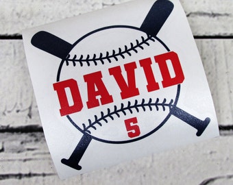 May include: White vinyl decal with a baseball and crossed bats. The baseball has black stitching and the word "DAVID" in red letters. The number "5" is also on the baseball.