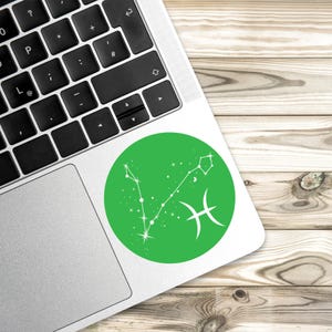 May include: Green circle sticker with a white outline featuring the Pisces zodiac constellation with white stars and the Pisces symbol.