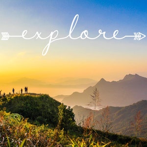 May include: A group of people stand on a mountaintop overlooking a valley with rolling hills and a hazy sky. The word "explore" is written in white cursive with arrows on either side. The sky is a gradient of blue, yellow, and orange.