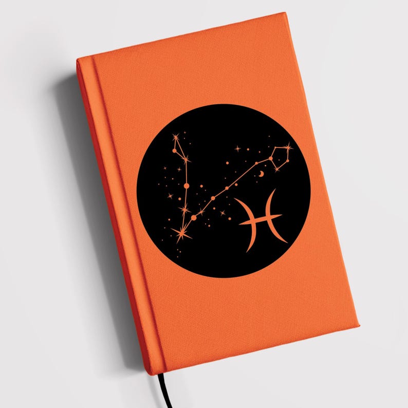 May include: Orange notebook with a black circle containing a constellation of stars and the Pisces zodiac symbol.