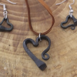 Handmade horseshoe nail heart pendant with matching earrings