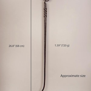May include: A hand-forged metal fire poker, approximately 26.8 inches (68 cm) long, with a decorative spiral handle and a curved end. The poker's head is 2.72 inches (7 cm) wide and weighs 1.59 ounces (720 g).