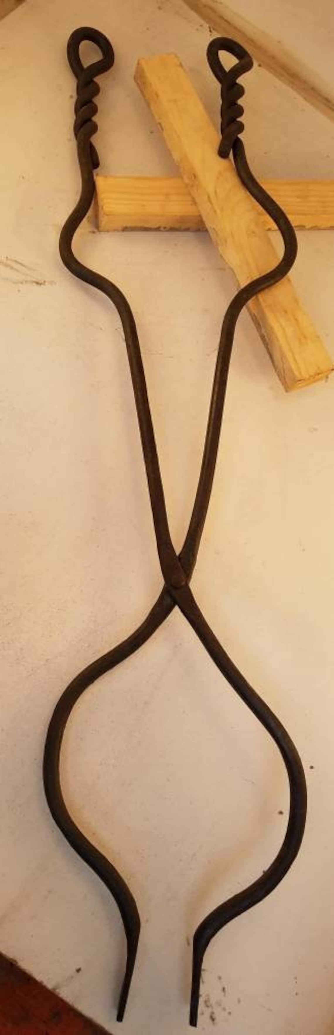 Blacksmith made fireplace tongs. Great for inside fireplace or Etsy
