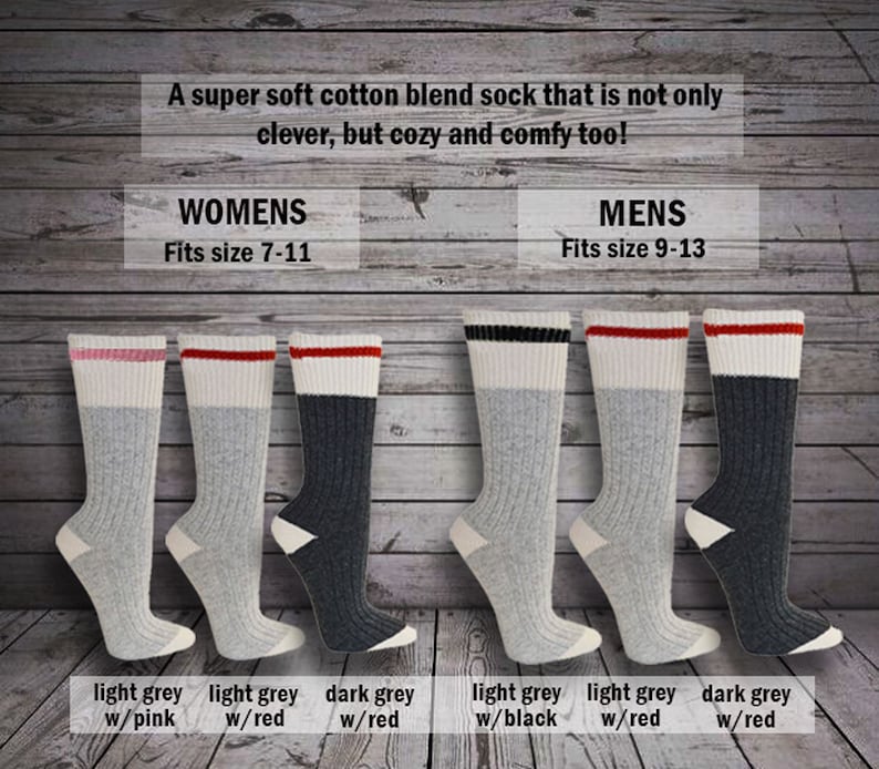 May include: Six pairs of cotton blend socks in various colors. The socks have a white band with a colored stripe at the top. The colors are light grey with pink, light grey with red, dark grey with red, light grey with black, light grey with red, and dark grey with red. The socks are arranged in two rows of three. The text "WOMENS Fits size 7-11" and "MENS Fits size 9-13" is above the socks.