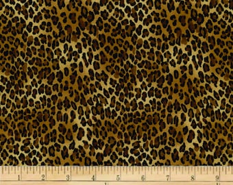 May include: Brown and black leopard print fabric with a ruler measuring 9 inches.