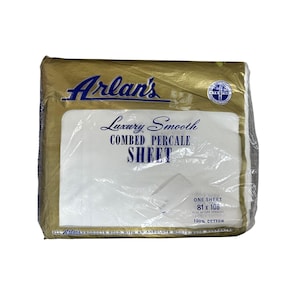 May include: A packaged white Arlan's Luxury Smooth Combed Percale Sheet. The packaging is gold with the Arlan's logo in blue. The sheet is 81 x 108 inches and made of 100% cotton. The packaging is sealed in clear plastic.