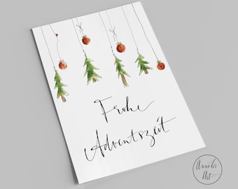 May include: A white card with a hand-drawn illustration of Christmas trees with red baubles hanging from them. The text "Frohe Adventszeit" is written in black calligraphy on the card.