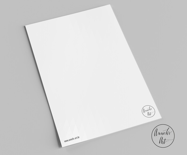 May include: A white sheet of paper with the text "Annelies Art" and "www.annelies-art.de" printed on it.