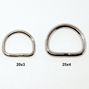 Könnte beinhalten: Vier silberfarbene D-Ringe in verschiedenen Größen sind abgebildet. Die Größen sind mit 15x3, 17x3, 20x3 und 25x4 gekennzeichnet. Die Ringe bestehen aus glänzendem Metall und sind vor einem weißen Hintergrund platziert. Diese Ringe werden wahrscheinlich für Bastelarbeiten oder Hardware verwendet.