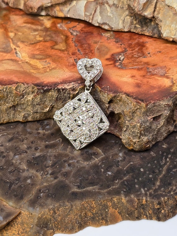 Sterling vintage and diamond pendant