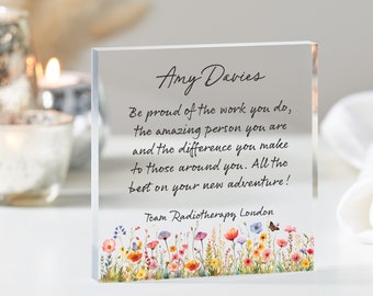 May include: A clear glass block with a floral design at the bottom. The text reads "Amy Davies Be proud of the work you do, the amazing person you are and the difference you make to those around you. All the best on your new adventure! Team Radiotherapy London"