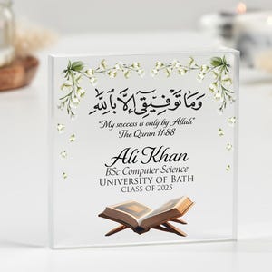 May include: A clear acrylic block with a white floral design and an inscription in Arabic script. The text translates to "My success is only by Allah." The Quran 11:88. Below the inscription is the name "Ali Khan", followed by "BSc Computer Science, UNIVERSITY OF BATH, CLASS OF 2025".