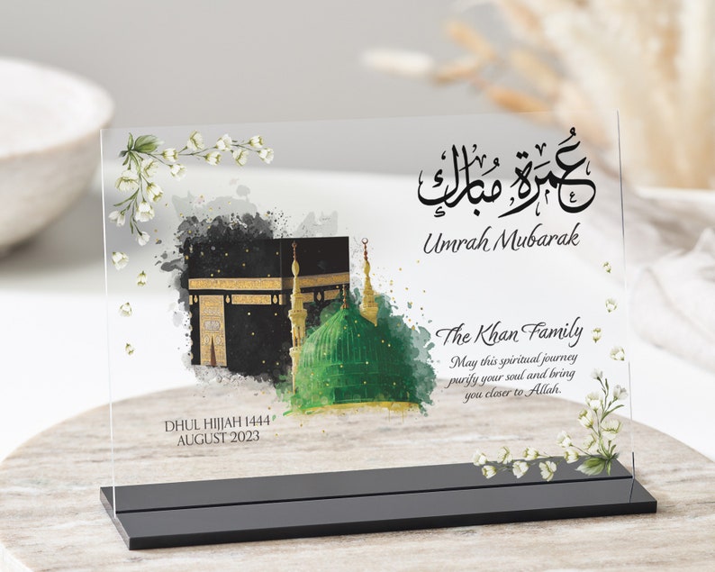 Clear plaque with black stand for Umrah Mubarak gift. Printed with Islamic quote with personalised family name and quote with dates. Bestseller for Eid mubarak gifts and Muslim gifts for couples and families.