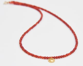 Carnelian and solid gold sun necklace.  Solid 18k gold sun charm and smooth orange gemstone "Here Comes the Sun" beaded choker necklace