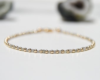 Natural white Diamond and solid 14k gold beaded bracelet.  Delicate, minimalist, modern tennis bracelet of diamond and solid 14 karat gold