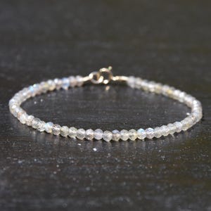 Labradorite and solid 14 karat gold bracelet, 3mm faceted iridescent Labradorite gemstone beads and 14k gold minimalist bracelet.  Unisex.