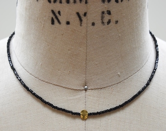 Black spinel and 18k gold Bali bead necklace, faceted tiny black spinel beads centered with a solid 18 karat gold handmade disc choker