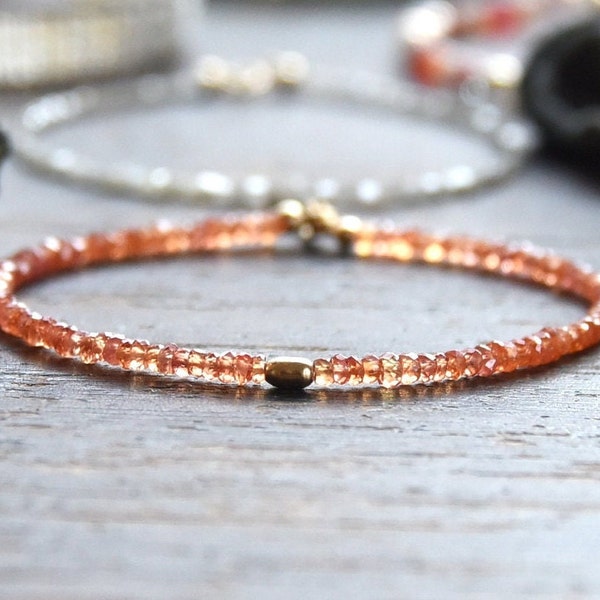 Ethereal orange pink Sapphire and gold bracelet.   Faceted Padparadscha Sapphire gemstones and Solid 14k gold bead bracelet