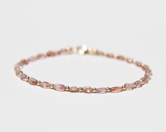 Tourmaline and solid gold bracelet.  Delicate peach pink Tourmaline gemstone and solid 14 karat gold beaded minimalist bracelet.