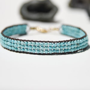 Natural Turquoise and solid gold bead bracelet, loom woven gemstone with leather and solid 14 karat gold.  Beautiful robin&#39;s egg blue.