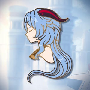 May include: A gold-coloured enamel pin featuring a blue-haired anime character with red horns. The character is wearing a gold necklace and has their eyes closed.