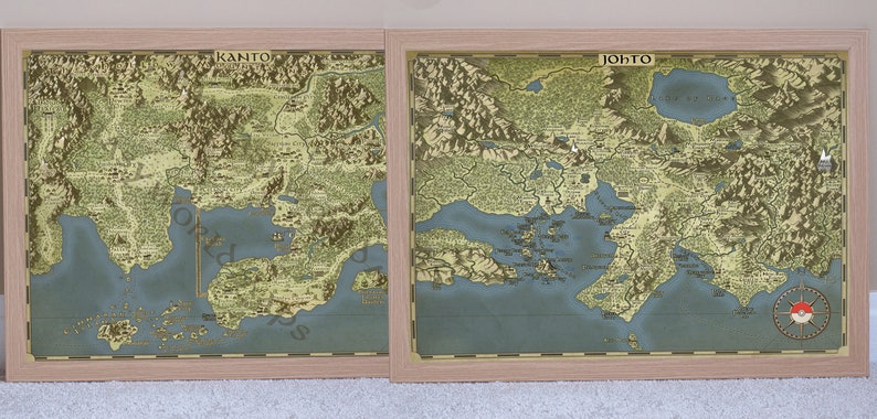 May include: Two framed maps of the Kanto and Johto regions from the Pokemon video game series. The maps are in a vintage style with a light blue ocean and green landmasses. The Kanto map features the text "KANTO" in the upper right corner, while the Johto map features the text "JOHTO" in the upper left corner. The Johto map also features a red and white Pokeball symbol in the lower right corner.