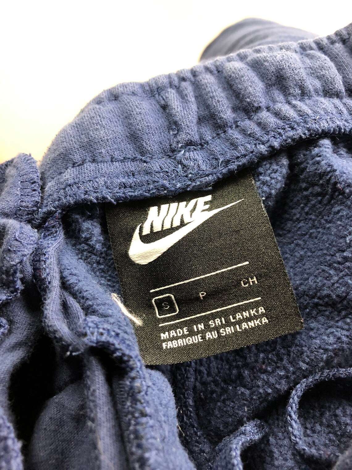 nike swoosh blue pants