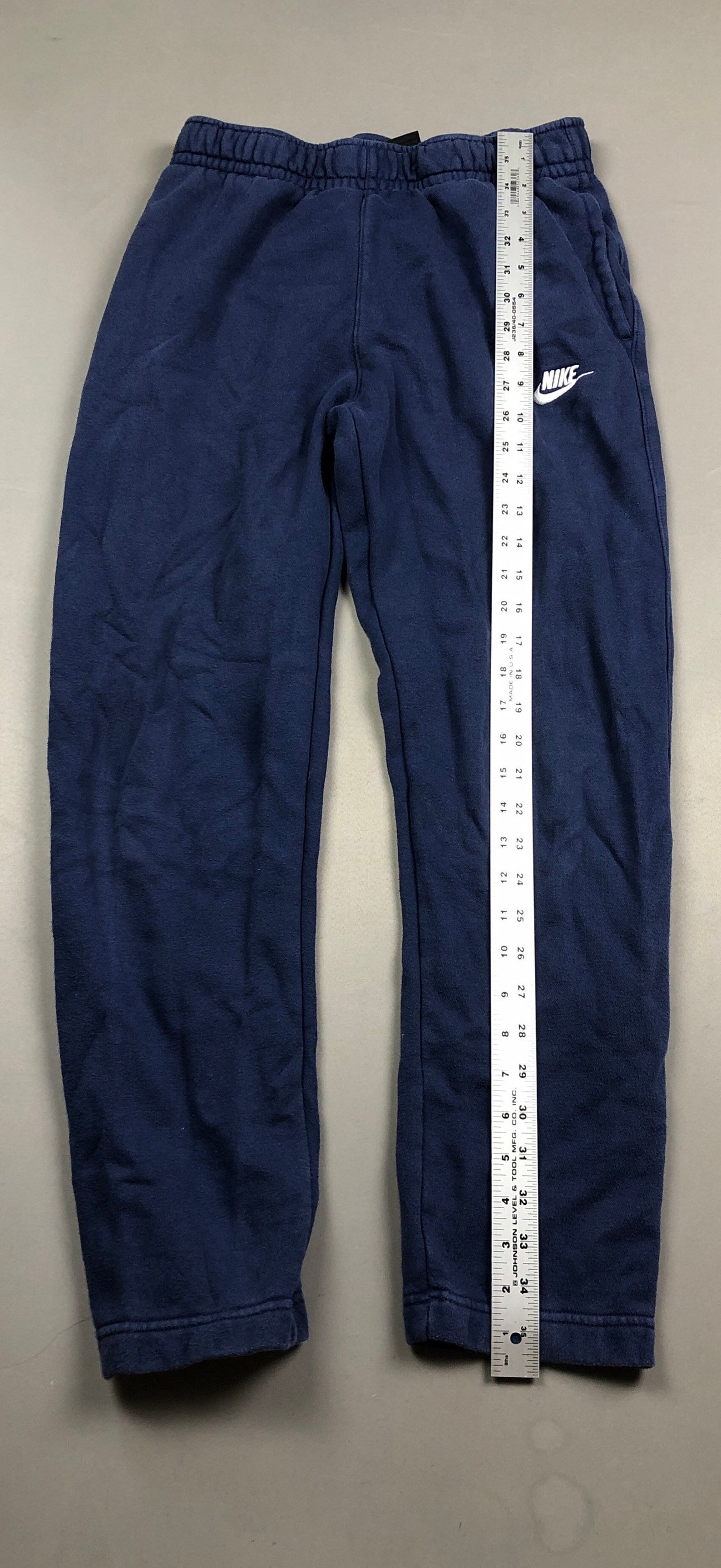 nike swoosh blue pants