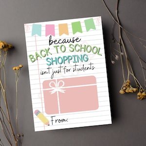 May include: A printable gift card with a pink gift box and a pencil. The text reads "because back to school shopping isn't just for students".