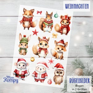 Könnte beinhalten: Bogen mit weihnachtlichen Bügelbildern mit Aquarellillustrationen von Waldtieren. Die Tiere, darunter Fuchs, Eichhörnchen, Hase und Eule, tragen festliche Winterkleidung. Der Bogen enthält auch dekorative Sterne und Ornamente.