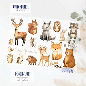 Könnte beinhalten: Ein Bogen mit Bügelbildern zeigt 18 Waldtiere im Aquarellstil, darunter Hirsch, Eichhörnchen, Wolf, Igel, Hase, Waschbär, Maus, Eule, Adler, Wildschwein und Bär, sowie die Schriftzüge Waldfreunde, Wild one und Wald Kind auf weißem Hintergrund.