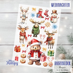 Könnte beinhalten: Ein Bogen mit weihnachtlichen Aufklebern mit Aquarellillustrationen. Die Designs umfassen Rentiere, einen Bären im Weihnachtsmann-Anzug, einen Schneemann, Geschenke, Schleifen, Schneeflocken und Zuckerstangen. Der Text "WEIHNACHTEN" und "BÜGELBILDER" sind sichtbar.
