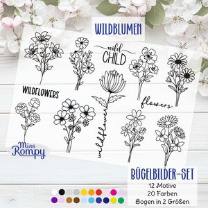 Könnte beinhalten: Ein Bogen mit Bügelbild-Designs mit schwarzen Strichzeichnungen von Wildblumen und den Wörtern "WILDFLOWERS", "wild CHILD" und "flowers". Der Bogen enthält auch eine Farbpalette und den Text "BÜGELBILDER-SET".