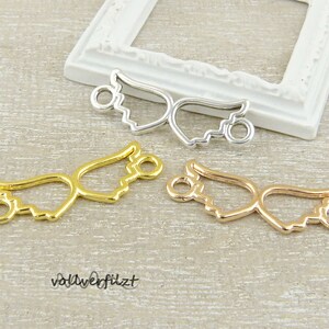 Könnte beinhalten: Drei Metall-Engel Flügel Charms in Silber, Gold und Roségold. Jeder Charm hat zwei Schlaufen zum Anbringen an Schmuck oder andere Bastelarbeiten.