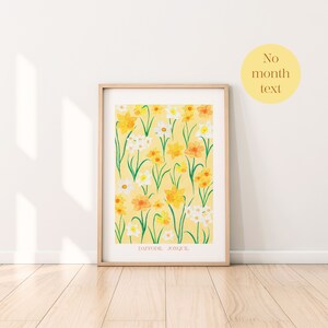 May include: A framed print of a yellow background with a pattern of white and yellow daffodils and jonquils. The text "DAFFODIL JONQUIL" is at the bottom of the print.