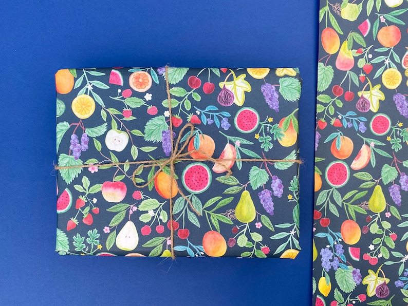 Summer fruit wrapping paper printed using vegetable inks. Fruits including, watermelon, lemons, oranges, pears, apples, grapes, mangoes, figs, peach, cherries. strawberries, raspberries, blackberries and blueberries. Originally painted with watercolours. Printed on a dark teal background.