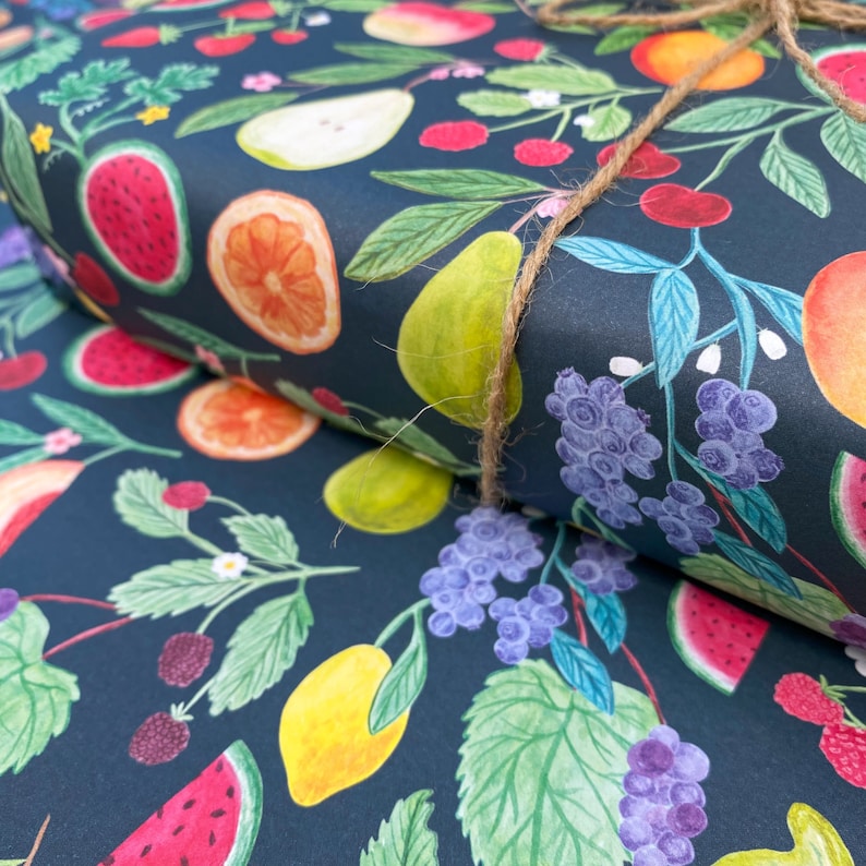 Summer fruit wrapping paper printed using vegetable inks. Fruits including, watermelon, lemons, oranges, pears, apples, grapes, mangoes, figs, peach, cherries. strawberries, raspberries, blackberries and blueberries. Originally painted with watercolours. Printed on a dark teal background.