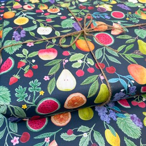 Summer fruit wrapping paper printed using vegetable inks. Fruits including, watermelon, lemons, oranges, pears, apples, grapes, mangoes, figs, peach, cherries. strawberries, raspberries, blackberries and blueberries. Originally painted with watercolours. Printed on a dark teal background.