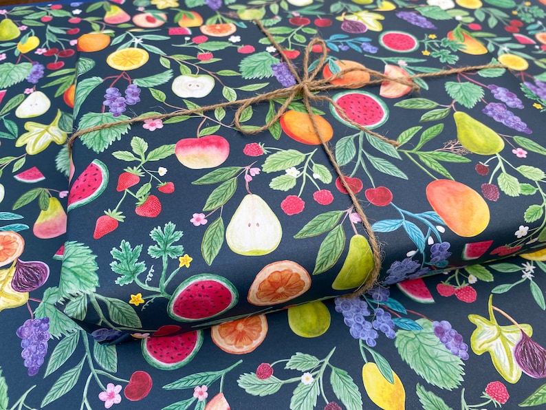 Summer fruit wrapping paper printed using vegetable inks. Fruits including, watermelon, lemons, oranges, pears, apples, grapes, mangoes, figs, peach, cherries. strawberries, raspberries, blackberries and blueberries. Originally painted with watercolours. Printed on a dark teal background.