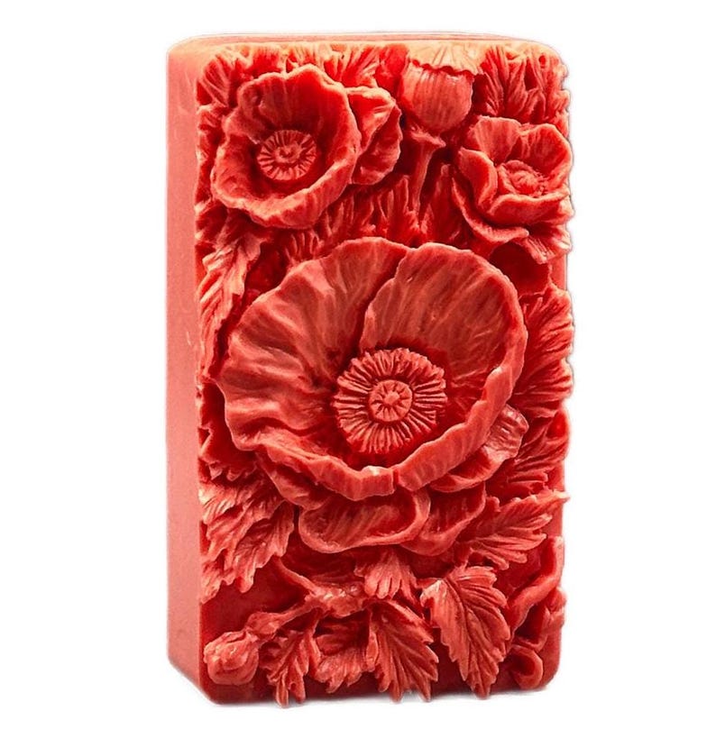 May include: A red soap bar with a detailed design of poppy flowers and leaves.