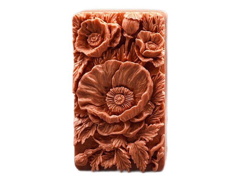 May include: A rectangular silicone mold with a detailed design of red poppy flowers. The mold is perfect for creating decorative soap bars or other crafts.